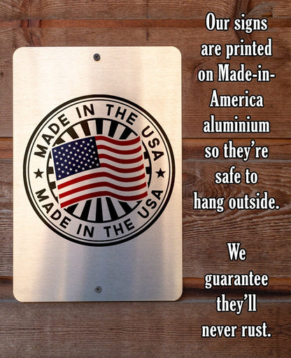 Square metal plaque with USA flag emblem and “Made in the USA” text